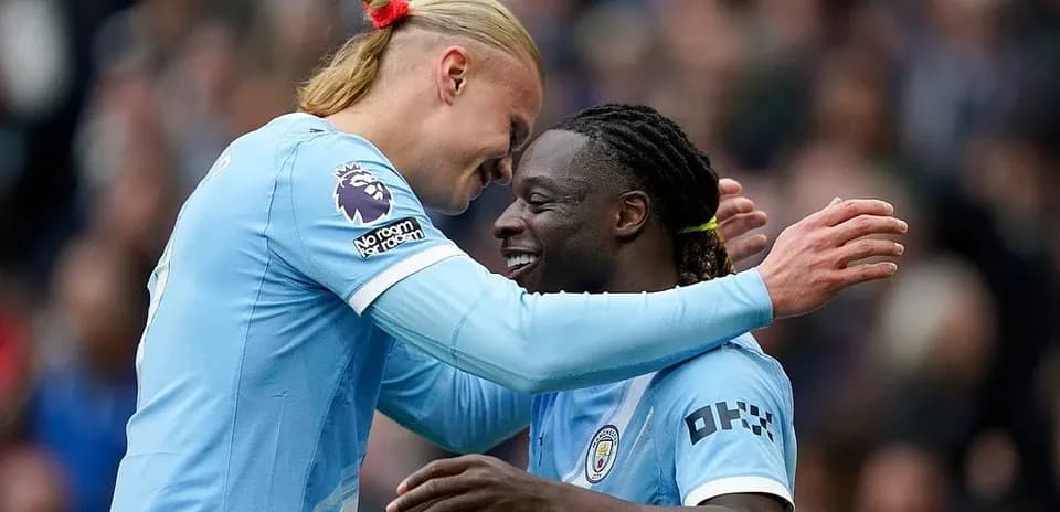 Manchester City players celebrating a goal