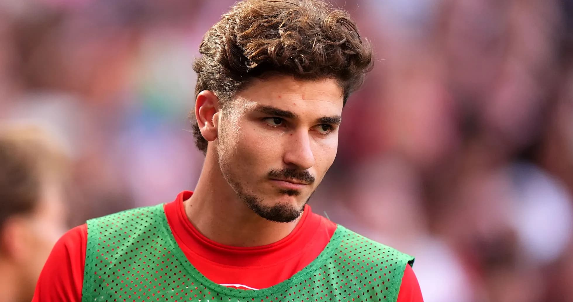 Player wearing training kit on the sidelines