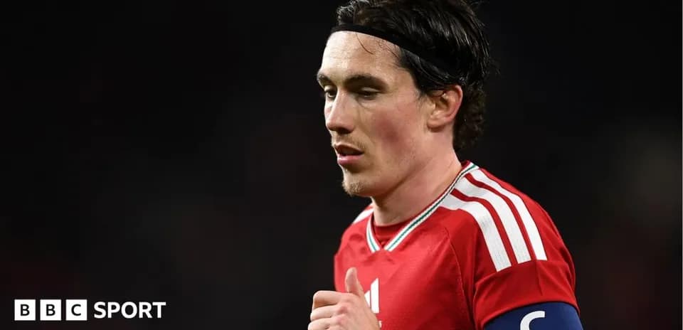 Player wearing red jersey and captain's armband