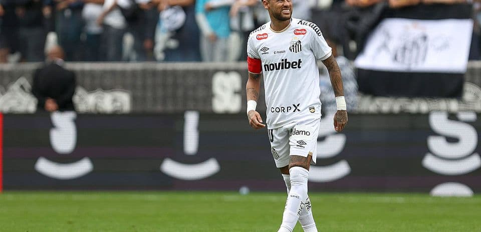 Player in white jersey smiling during match