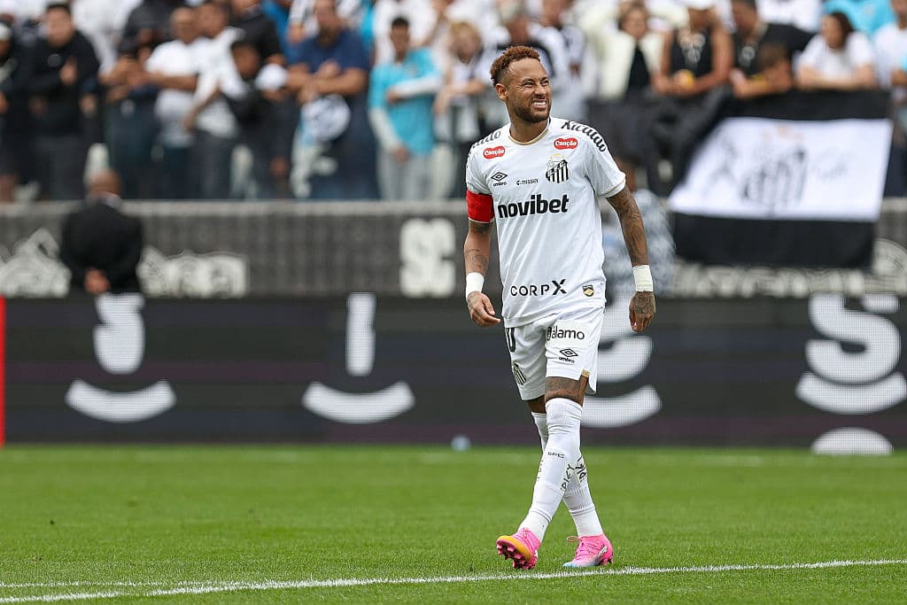 Player in white jersey smiling during match