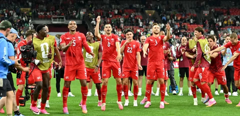 Switzerland players celebrating after match victory