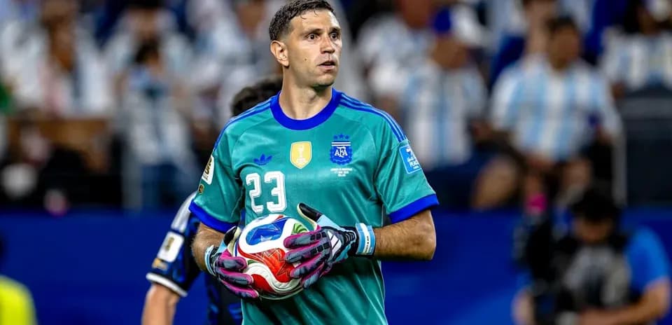 Goalkeeper holding ball during match action