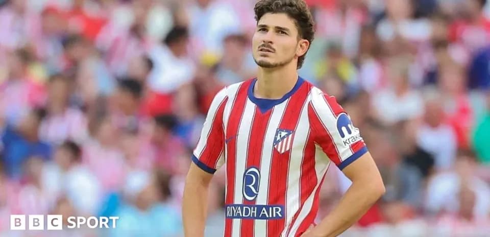 Atletico Madrid player looking concerned during match