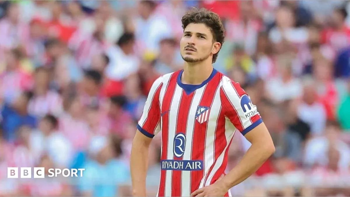 Atletico Madrid player looking concerned during match