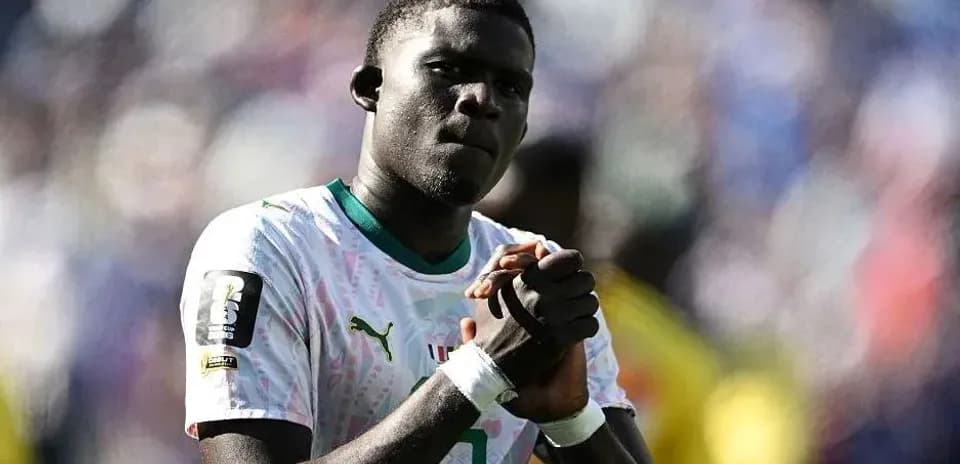 Player with clasped hands during match celebration