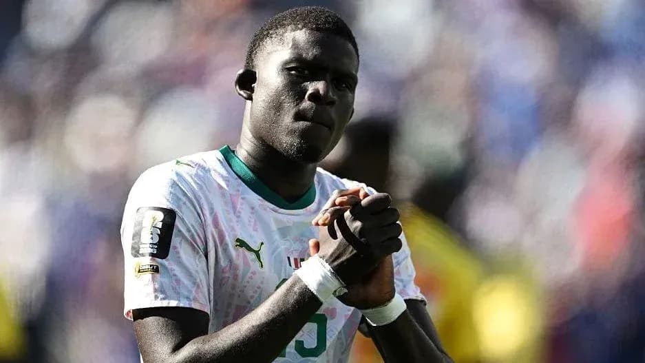 Player with clasped hands during match celebration