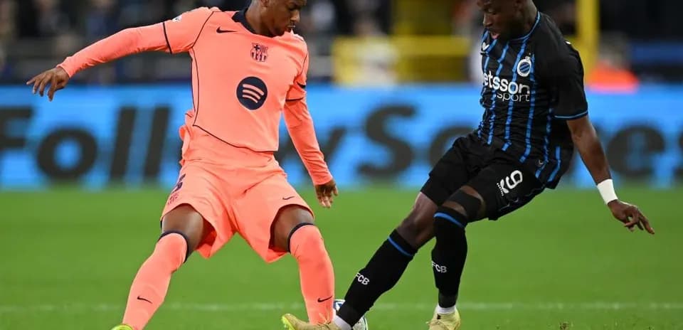 Two players competing for the ball on the field
