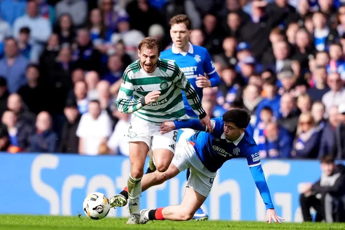Celtic player evading tackle from Rangers player