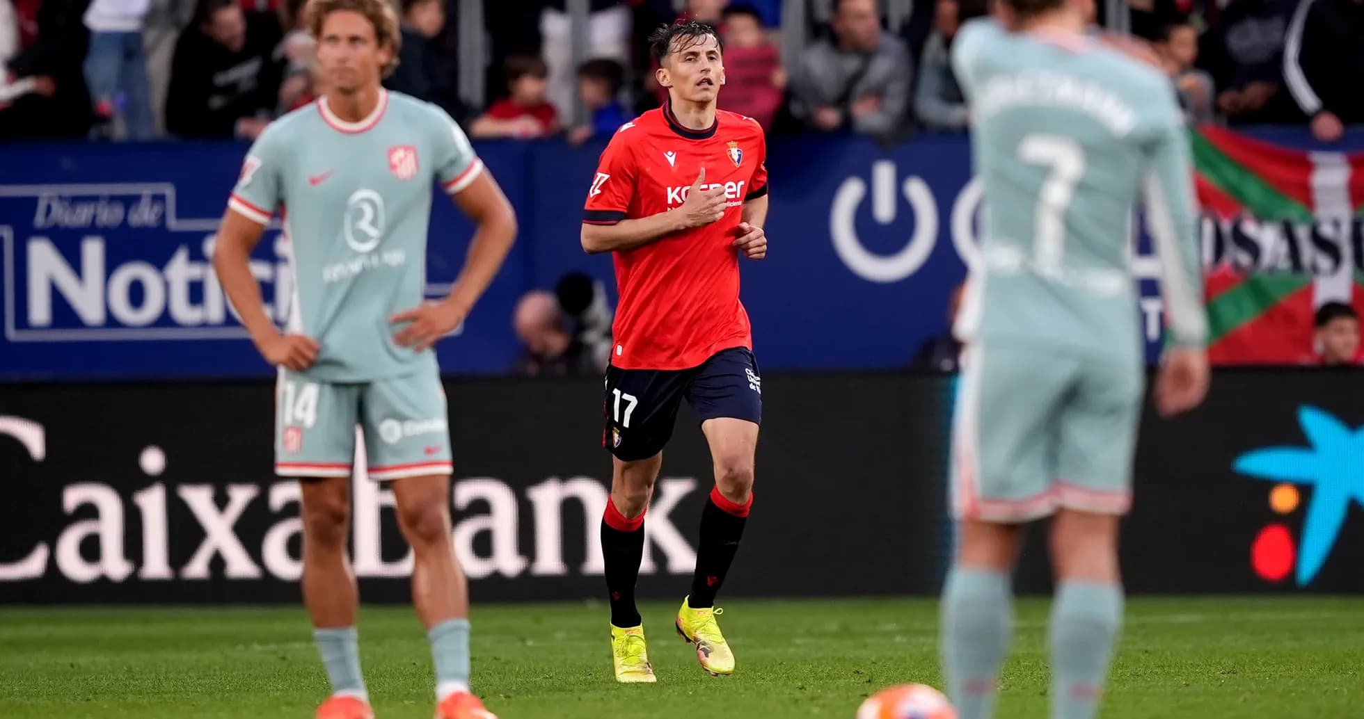Osasuna player in action against Atletico Madrid