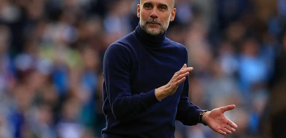 Manager gesturing during a match on the sideline