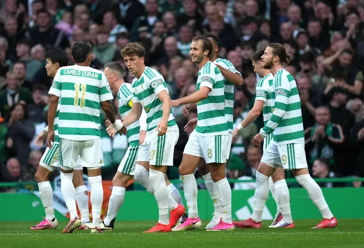 Celtic players celebrating a goal on the field