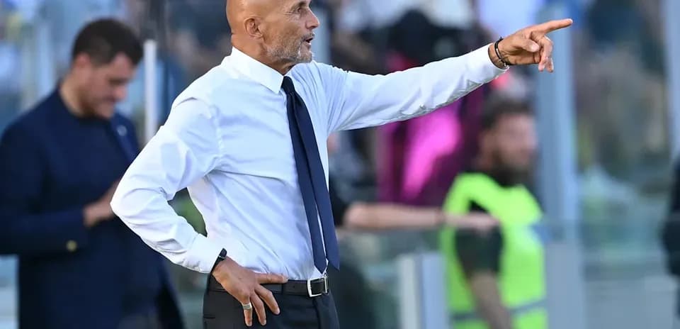 Manager gesturing from the sidelines during match