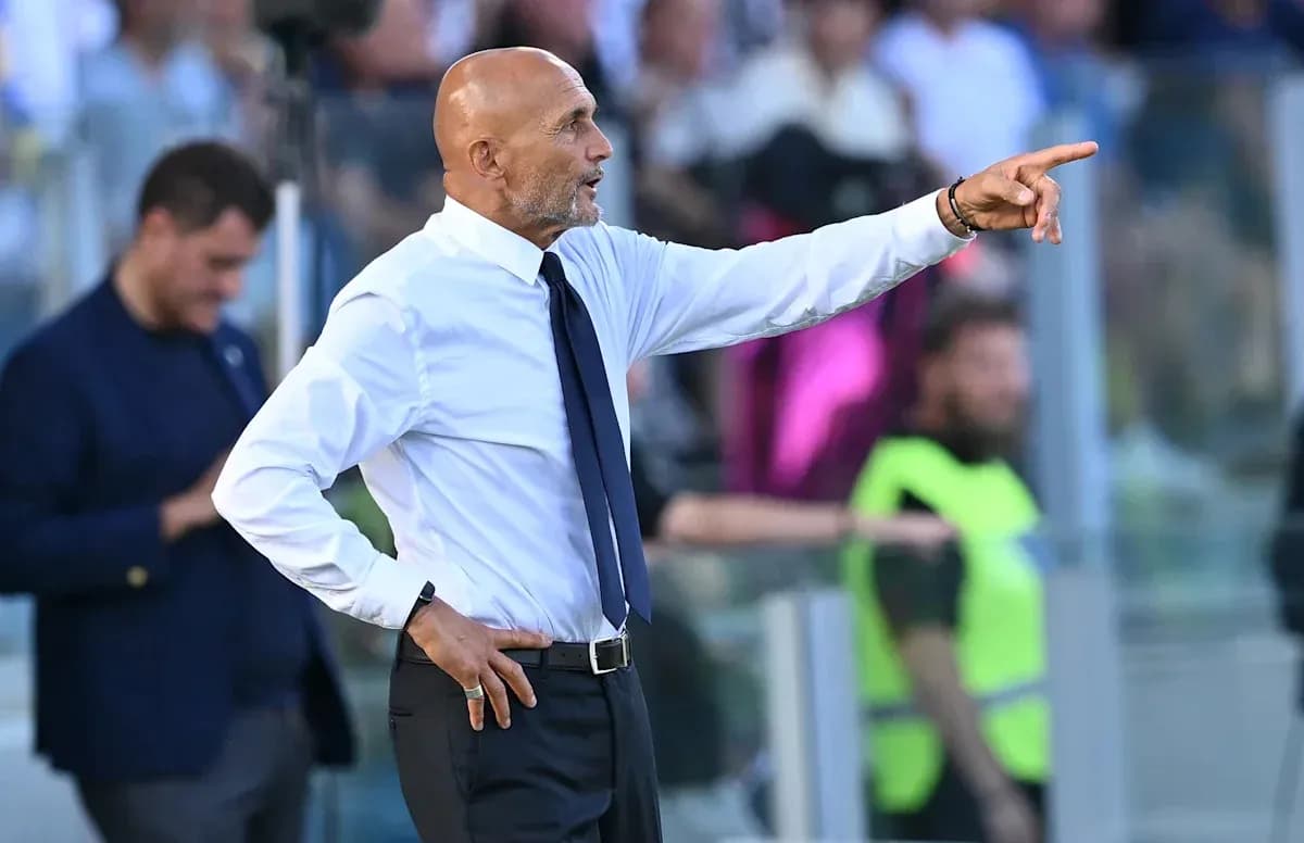Manager gesturing from the sidelines during match