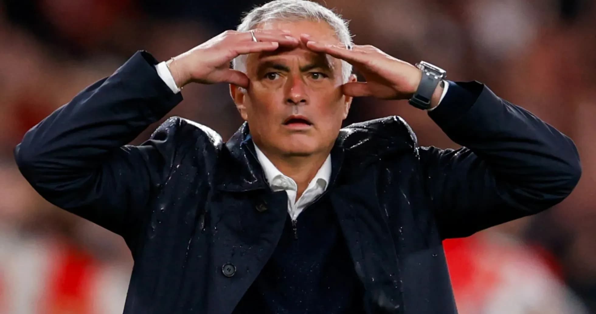Coach gesturing during a match on the sidelines
