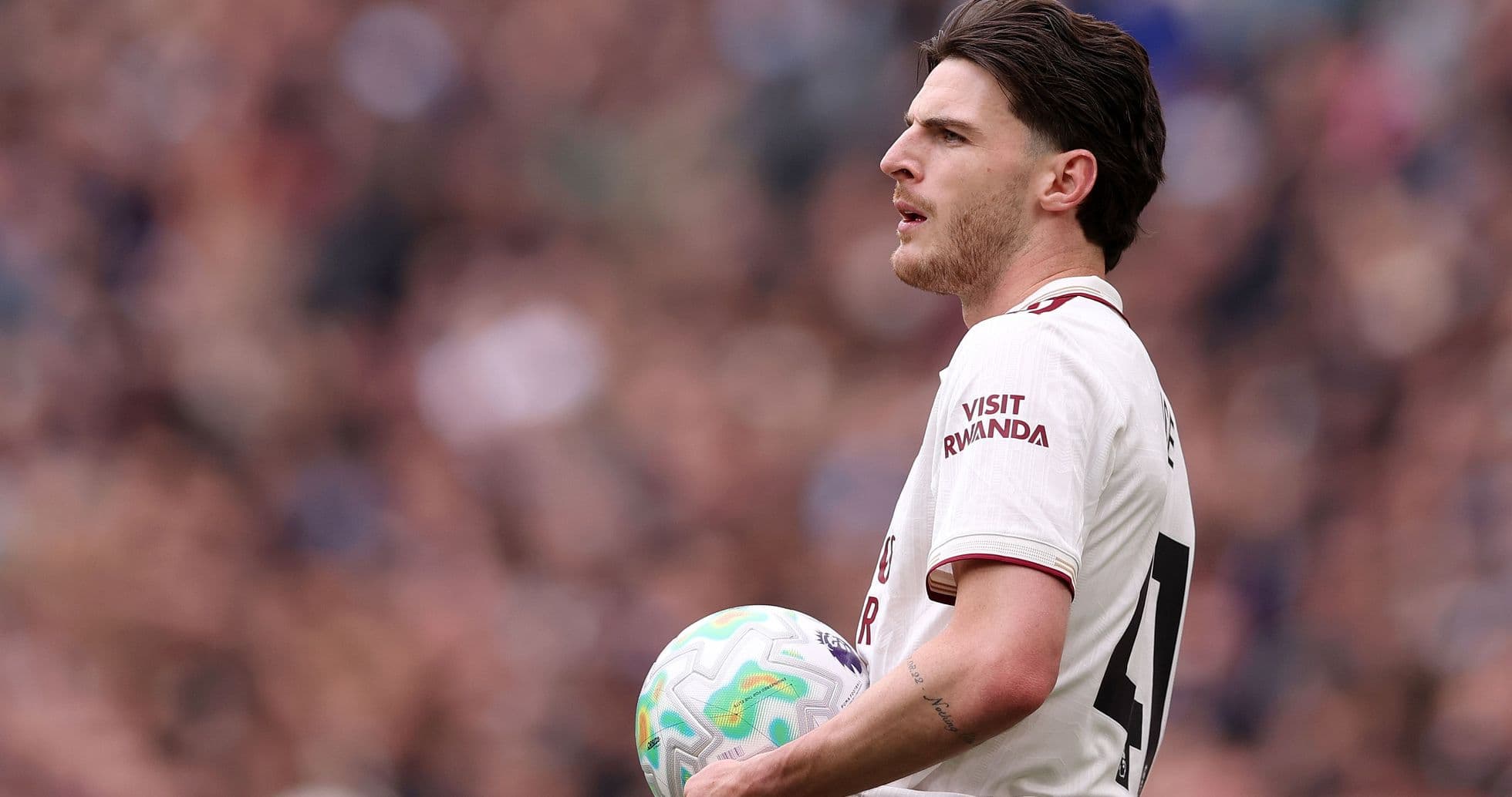Player holding the ball during a match