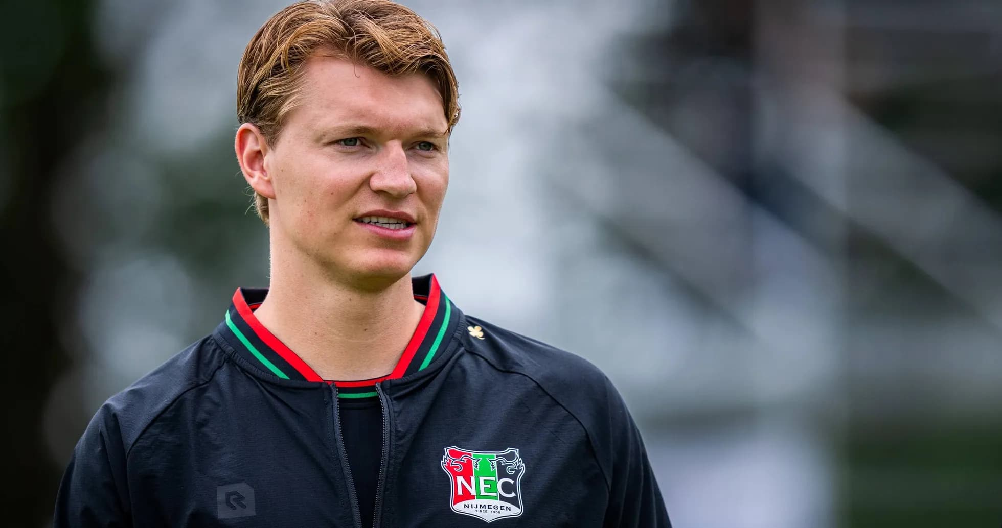 Player wearing NEC Nijmegen jacket during training session