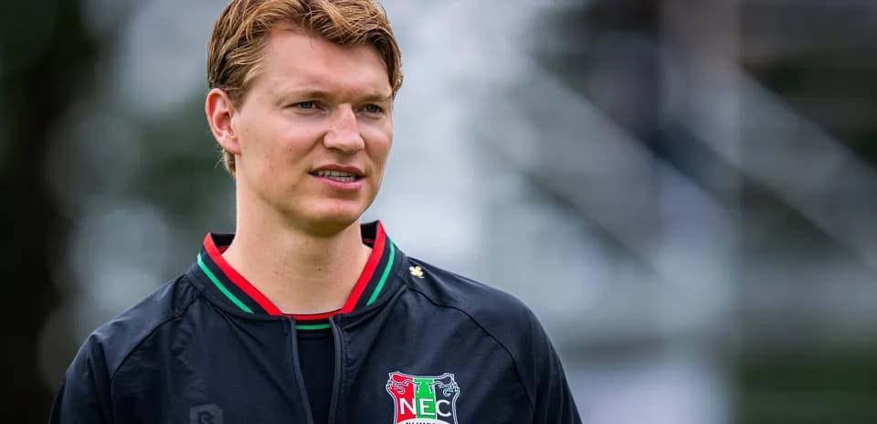 Player wearing NEC Nijmegen jacket during training session