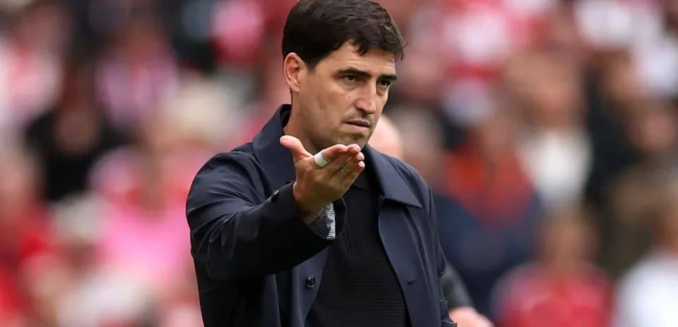 Coach gesturing during a match on the sideline