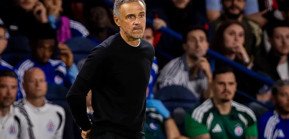 Coach observing match from the sidelines