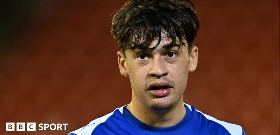 Player in blue jersey after the match
