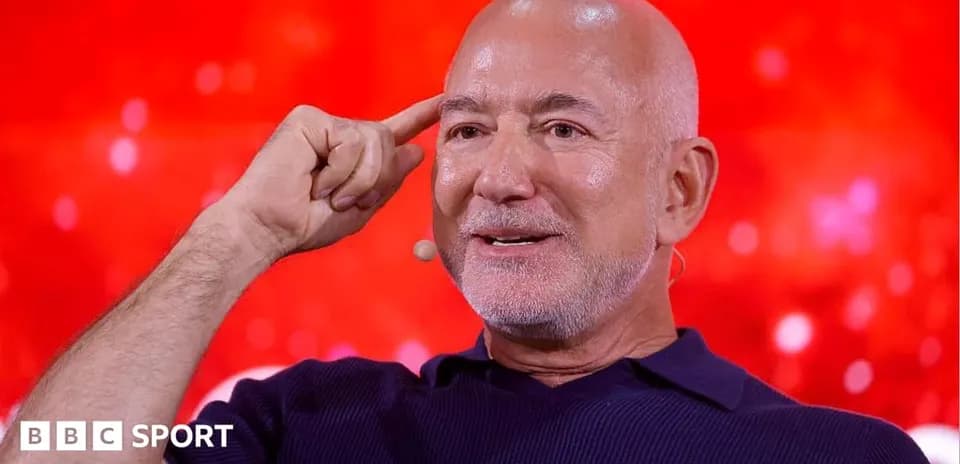 Person speaking with hand gesture on stage