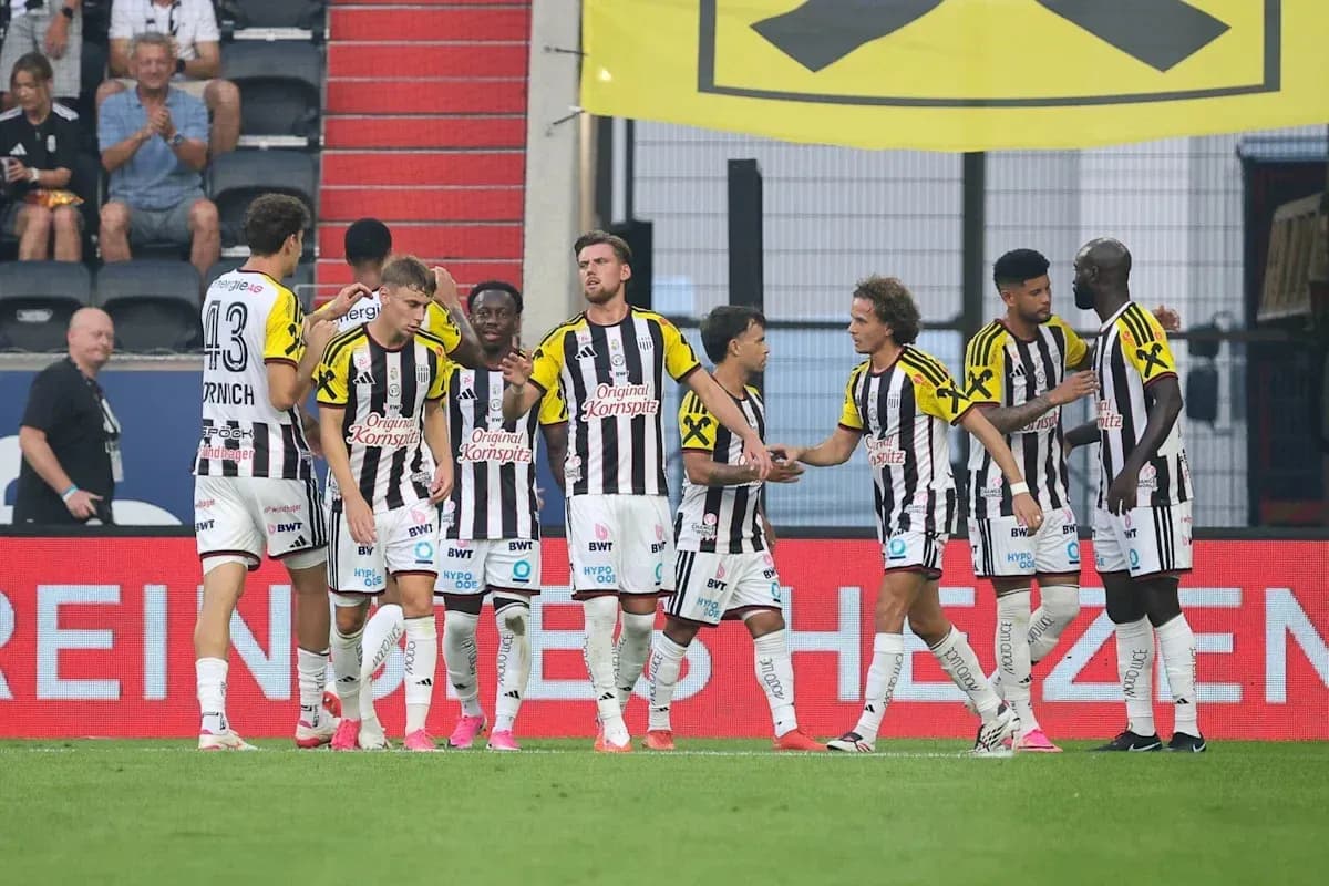 Players celebrating a goal on the pitch
