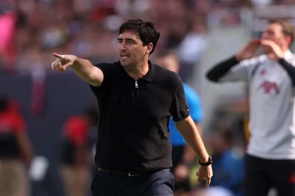 Coach giving instructions from the sidelines during match