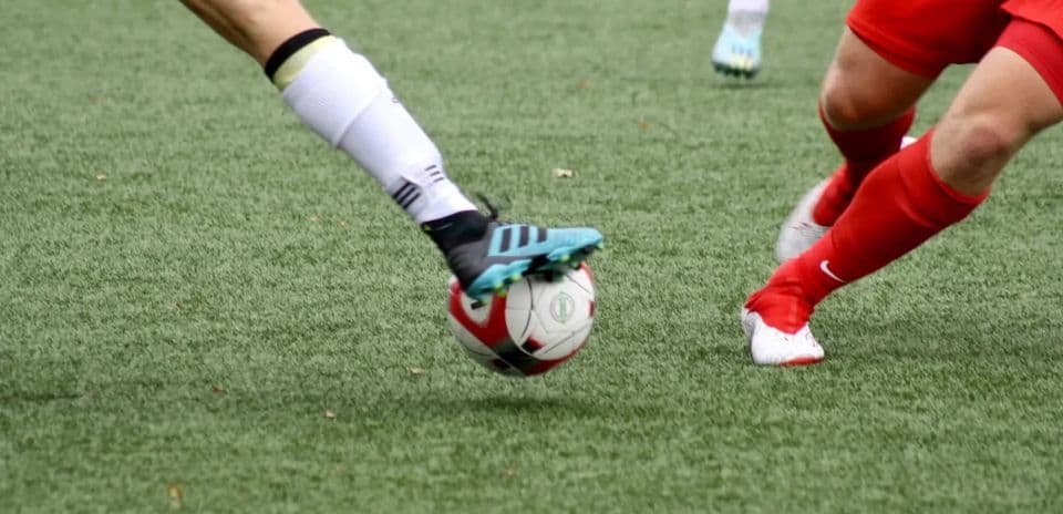 Players contesting for the ball on the field