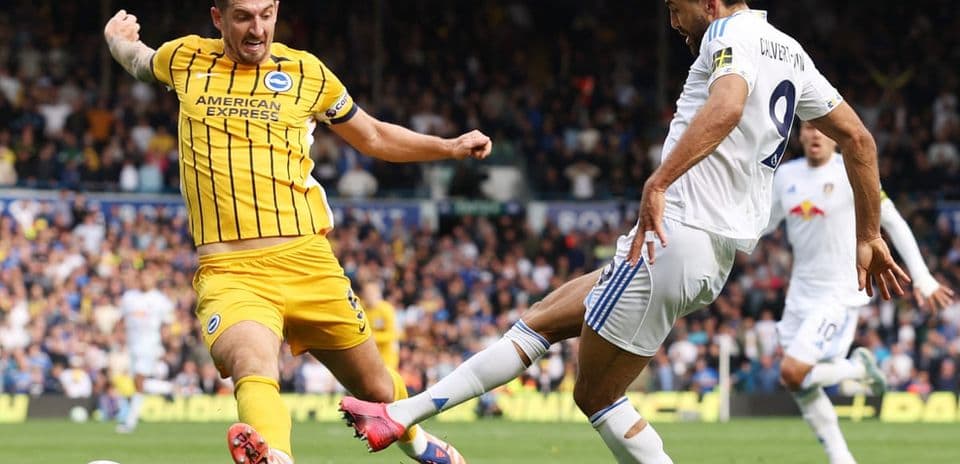 Leeds and Brighton players competing for the ball