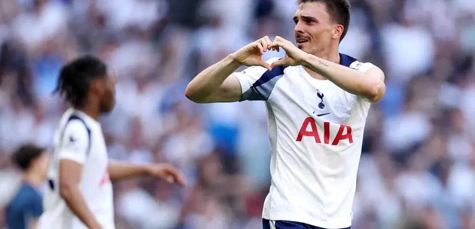 Player celebrating with heart gesture during match