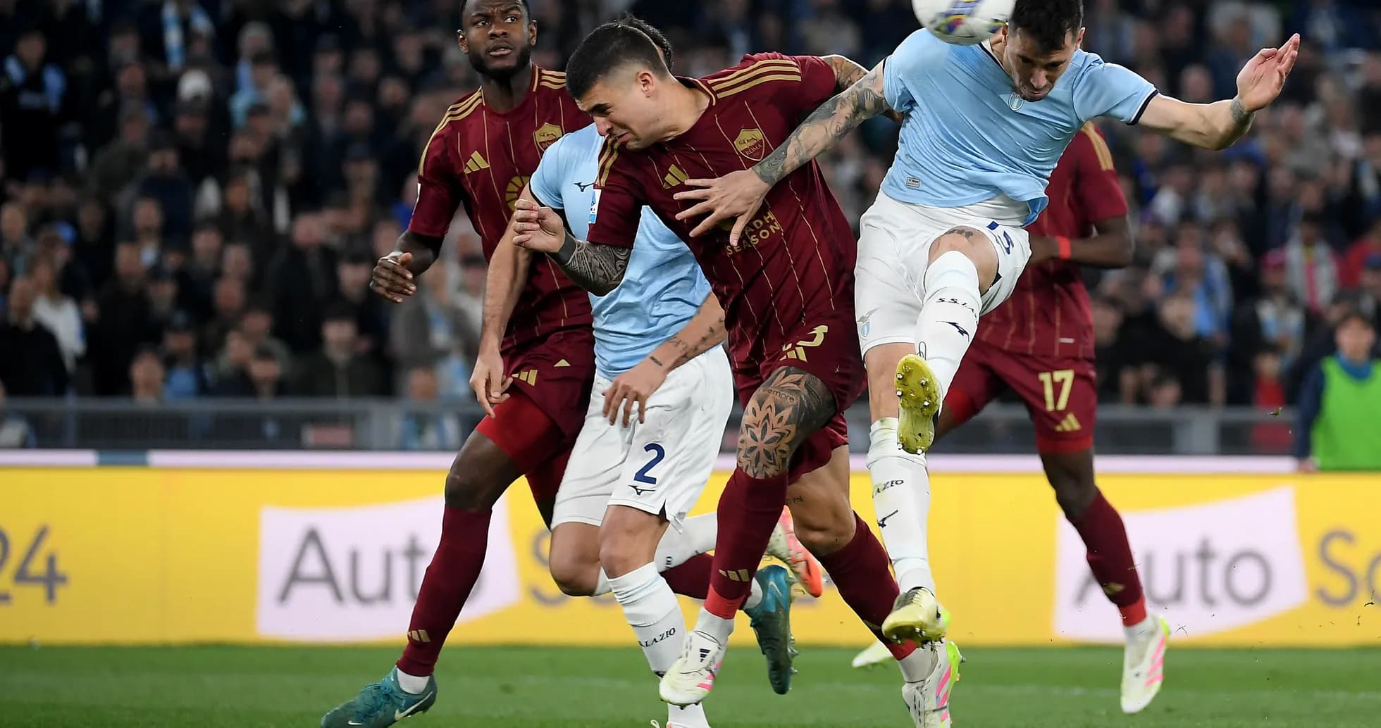 Players competing for the ball in derby match