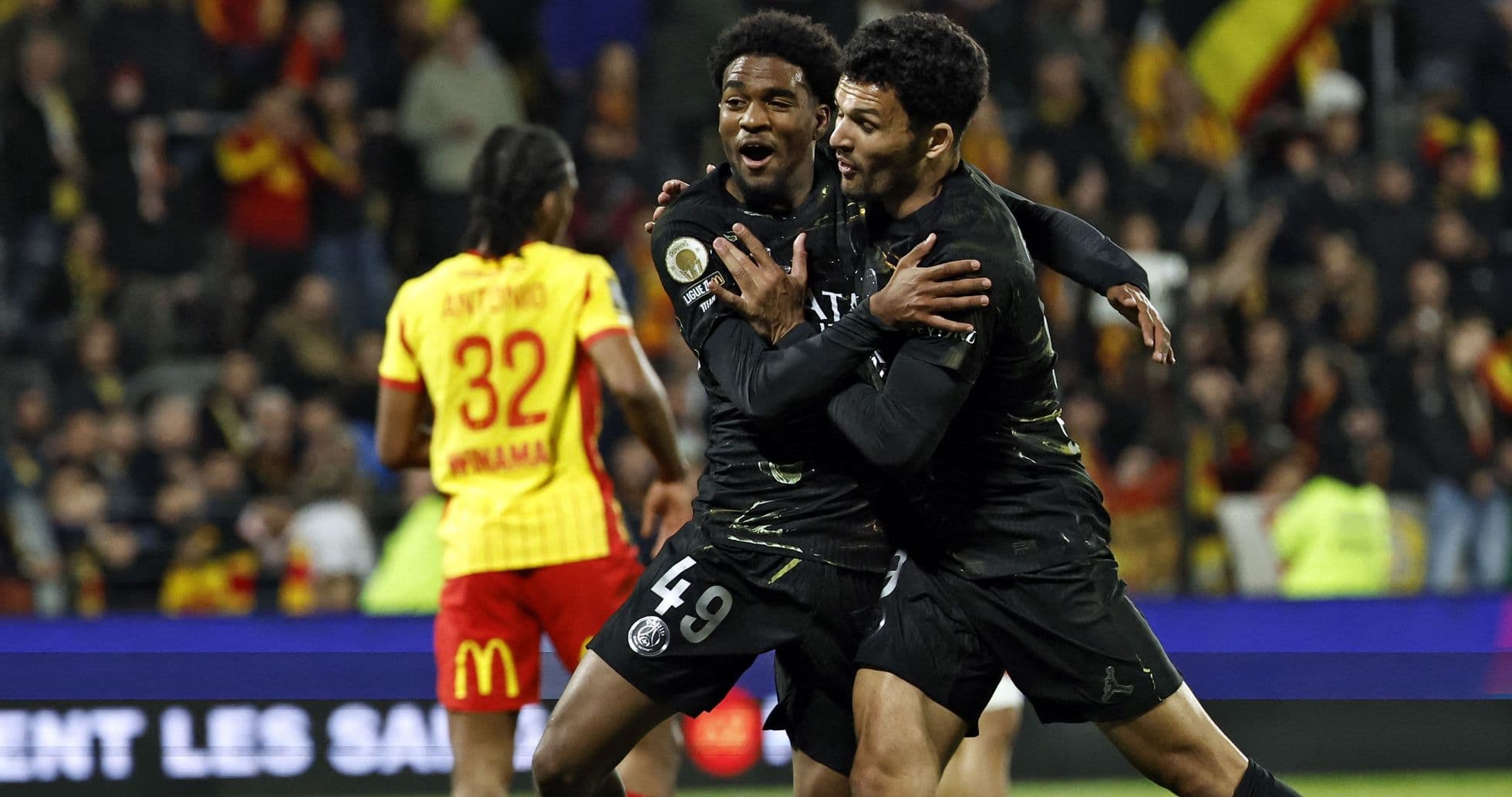 Two players celebrating a goal during match