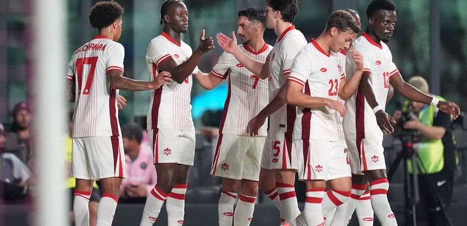 Canada players celebrating a goal during match