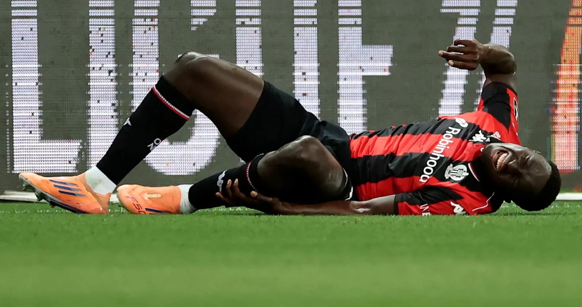 Player lying on the ground after injury during match