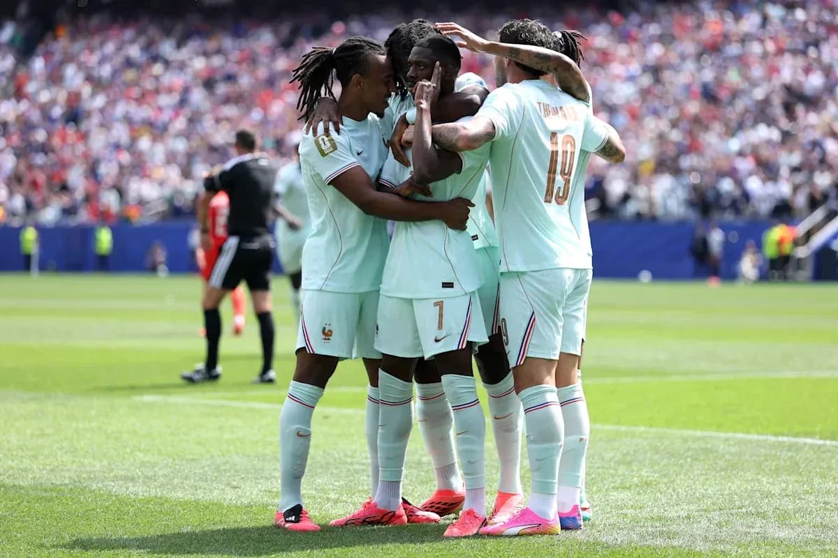 Players celebrating a goal on the field