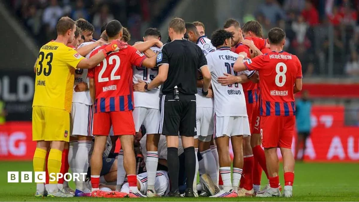 Players from both teams gathered around an injured player