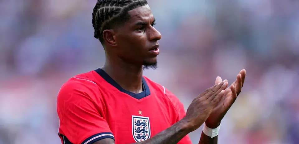 Player applauding during match wearing red England jersey