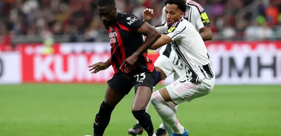 Player tackling opponent during Juventus vs AC Milan match