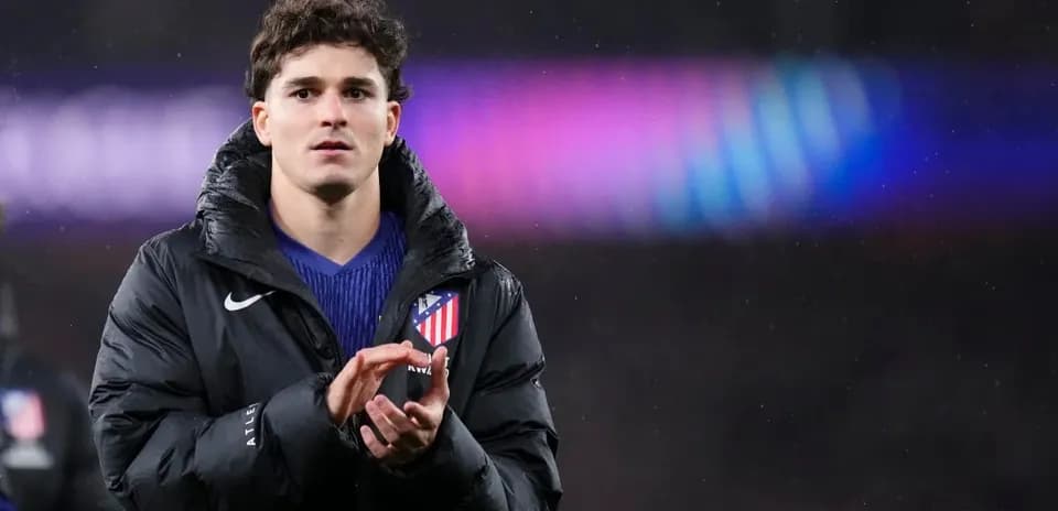 Player applauding in Atletico Madrid jacket