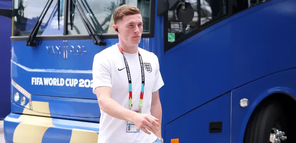 Player walking near team bus at FIFA World Cup