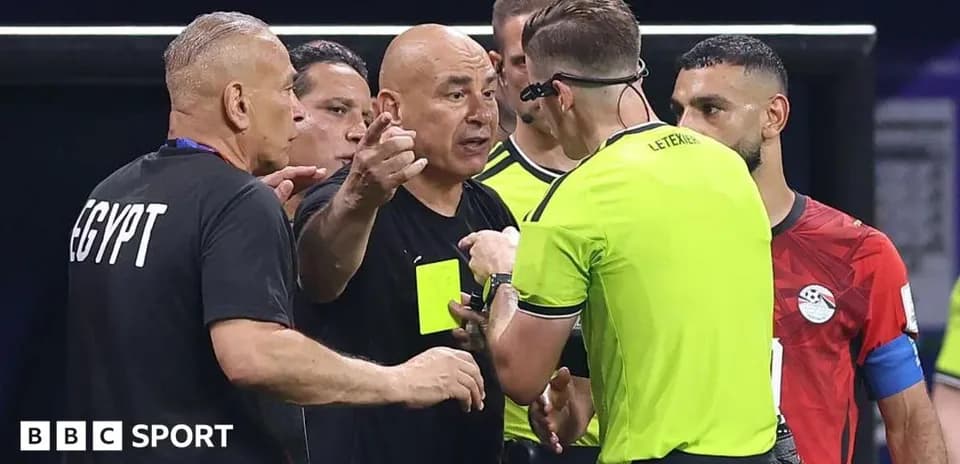 Coach discussing with referee during a match