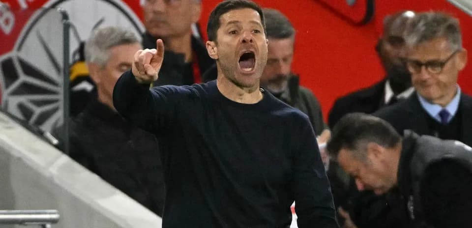 Coach directing players during a match from the sidelines
