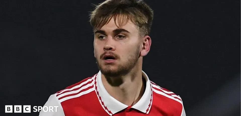 Player in Arsenal jersey during match action
