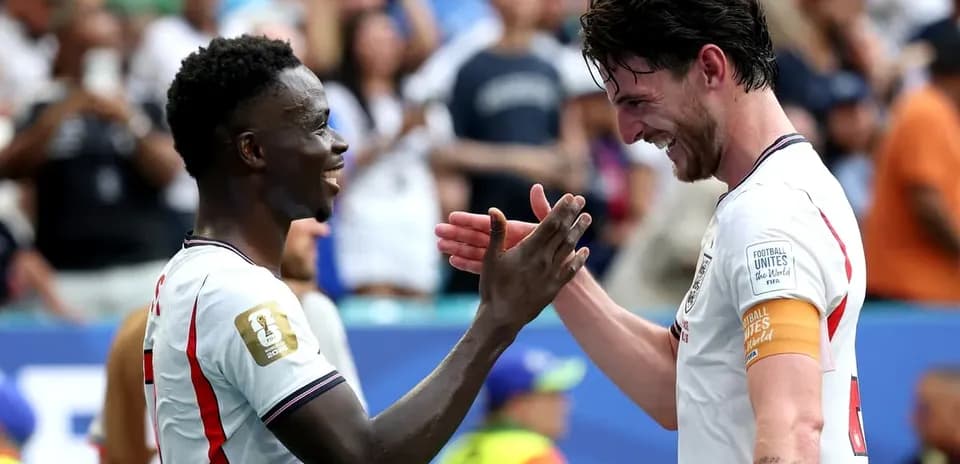 Two players celebrating on the field after match