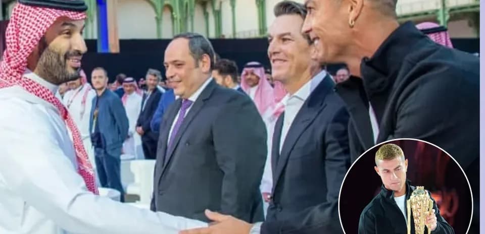 People at event with handshake and trophy presentation