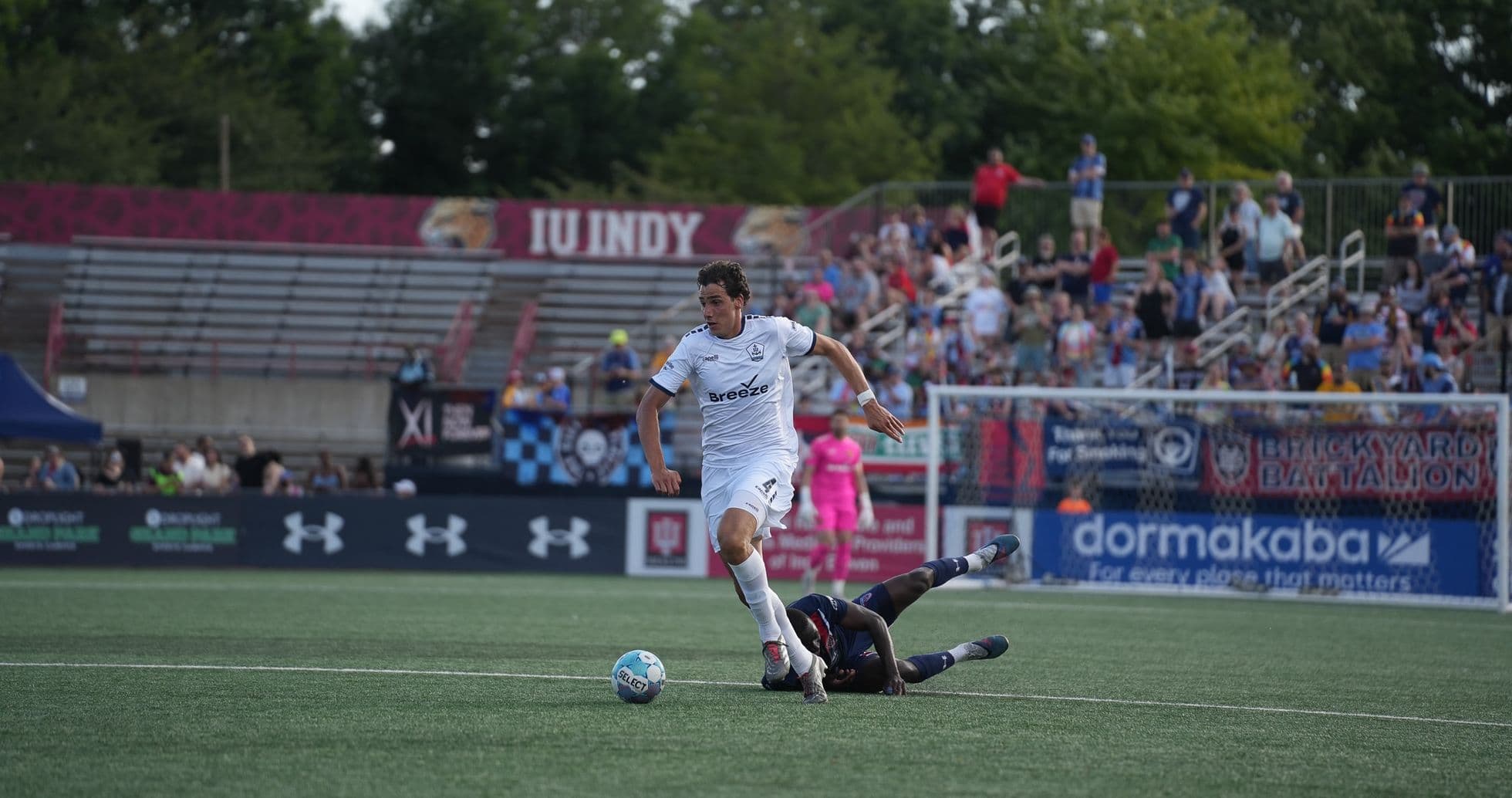 Player dribbling the ball during match action