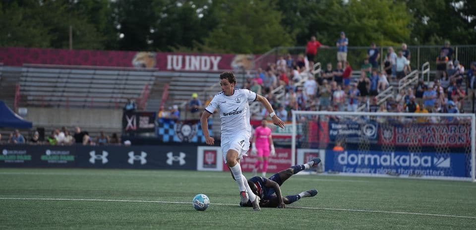 Player dribbling the ball during match action