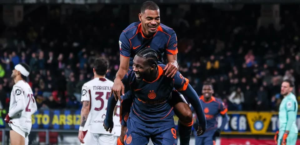 Players celebrating after scoring a goal during match