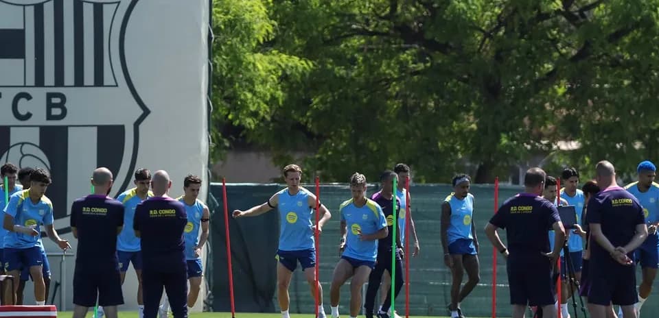 Barcelona players training on pitch with cones